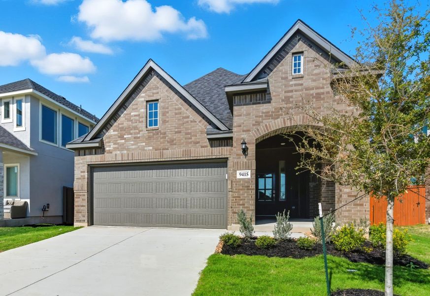 Front exterior of a new home in Stillwater Ranch, San Antonio, TX, highlighting curb appeal (Image 22). Front exterior of a new home in Stillwater Ranch, San Antonio, TX, highlighting curb appeal (Image 22).