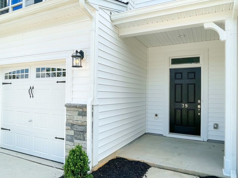 Front exterior of a new home in Fairview Village Townhomes, Simpsonville, SC, highlighting curb appeal (Image 2).