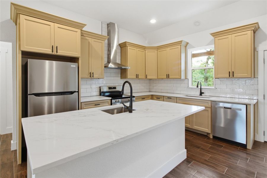 Modern kitchen with white countertops and light cabinetry, offering ample space for culinary endeavors. Modern kitchen with white countertops and light cabinetry, offering ample space for culinary endeavors.