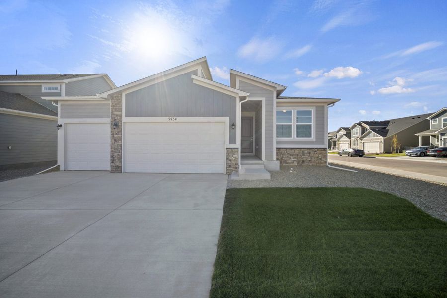Front exterior of a new home in The Trails at Aspen Ridge, Colorado Springs, CO, highlighting curb appeal (Image 22).