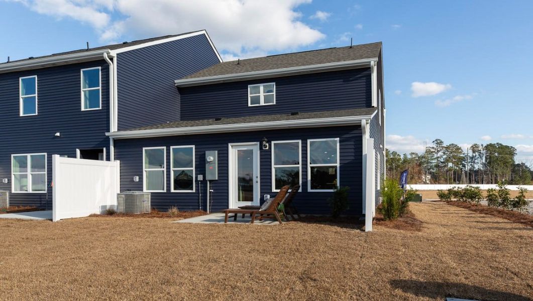 Exterior details and patio area of a home in Grayson Park Duets, Leland (Image 2).