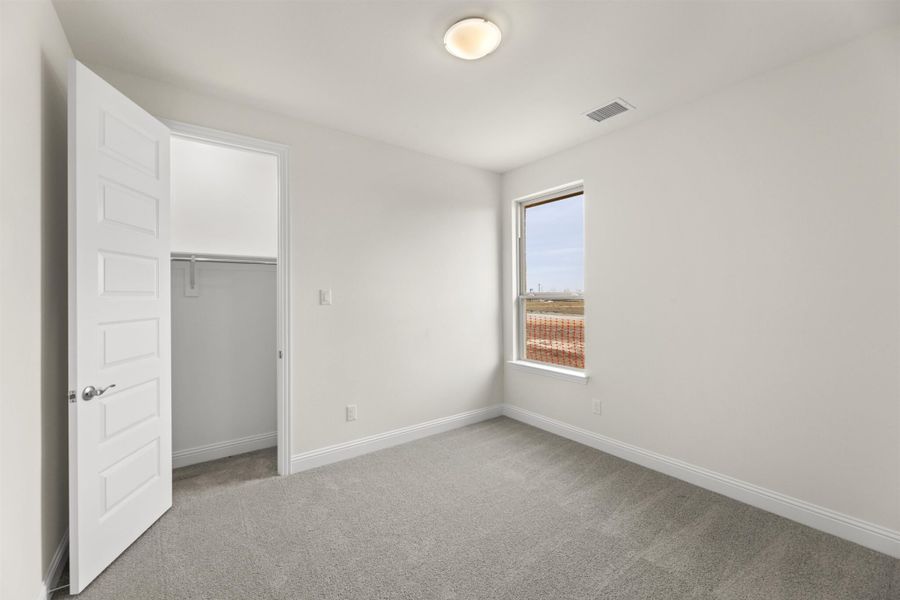 Representative unfurnished interior of a home built from the Juniper by UnionMain Homes in Edgewater, Fate (Image 17).