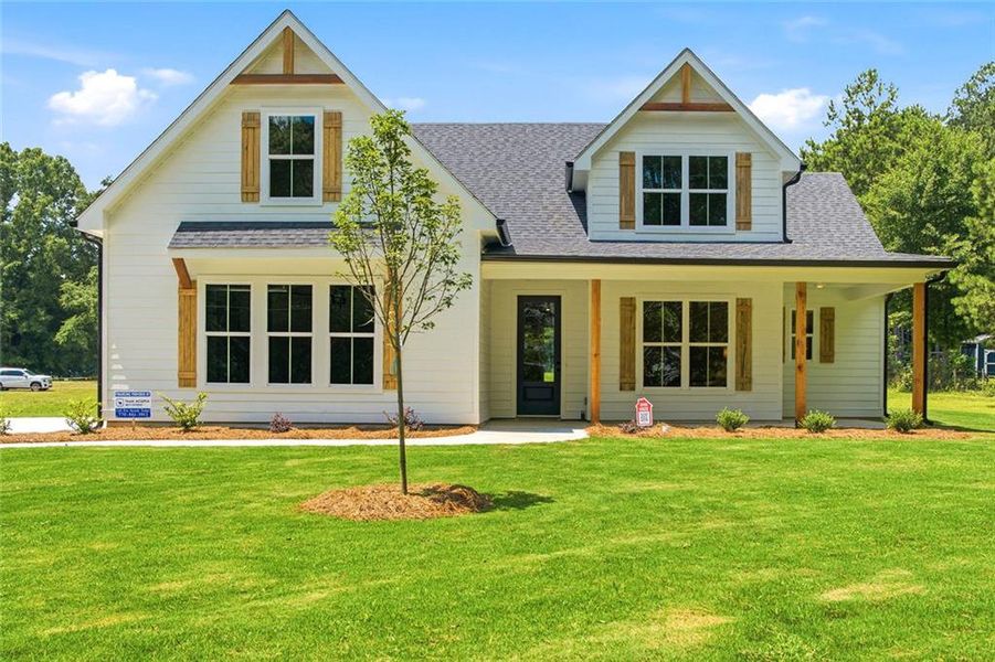 Front exterior of a new home in , Mansfield, GA, highlighting curb appeal (Image 2). Front exterior of a new home in , Mansfield, GA, highlighting curb appeal (Image 2).