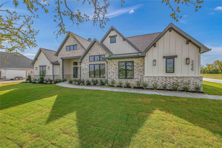 Front exterior of a new home in , College Station, TX, highlighting curb appeal (Image 26).