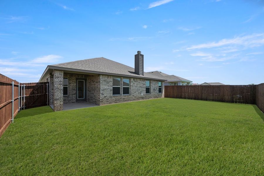Representative exterior photo of a completed home built from the Cheyenne by Impression Homes in Baker Farms, Cleburne, TX (Image 23).