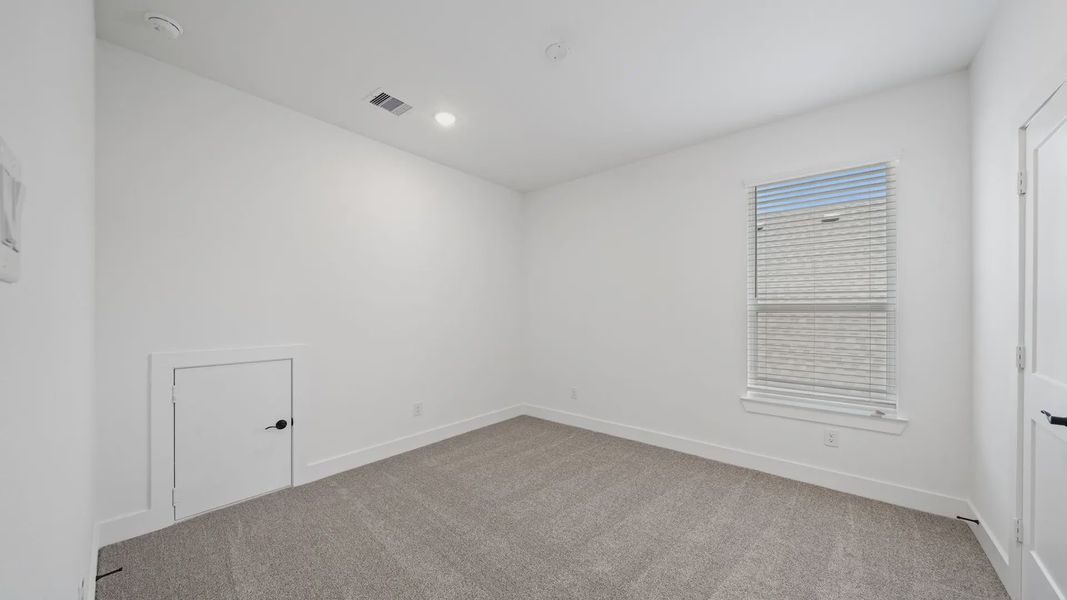 Representative unfurnished interior of a home built from the Waterloo by Chesmar Homes in Attwater 65's, Waller (Image 37).