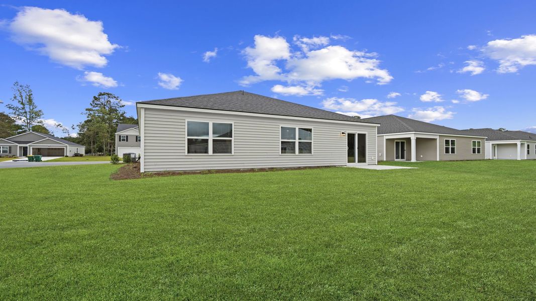 Exterior details and patio area of a home in The Groves at Bees Creek, Ridgeland (Image 4).