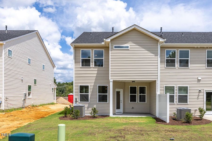 Front exterior of a new home in Springvale, Fuquay Varina, NC, highlighting curb appeal (Image 2).