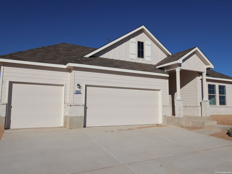 Front exterior of a new home in Hickory Ridge, Elmendorf, TX, highlighting curb appeal (Image 25).