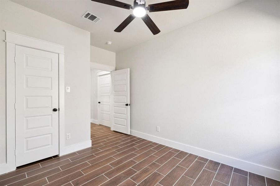 Unfurnished room featuring ceiling fan