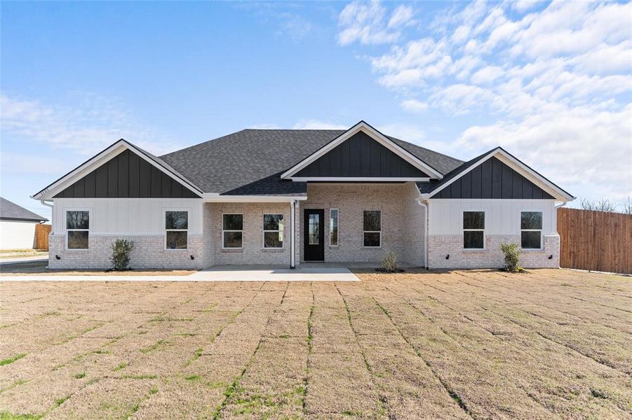 Front exterior of a new home in , Greenville, TX, highlighting curb appeal (Image 21).