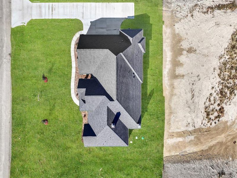 Front exterior of a new home in , Weatherford, TX, highlighting curb appeal (Image 23).