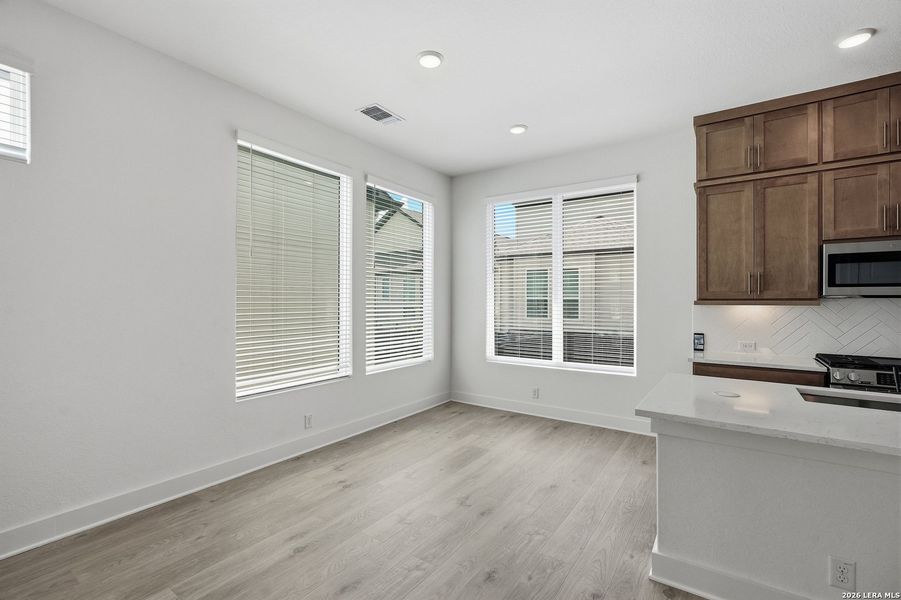 Spacious, unfurnished interior of a new home in Centero at Stone Oak, San Antonio (Image 31).