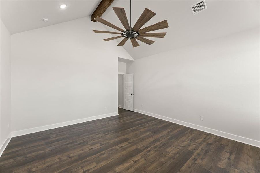 Unfurnished room with beamed ceiling, dark wood-style floors, and high vaulted ceiling Unfurnished room with beamed ceiling, dark wood-style floors, and high vaulted ceiling