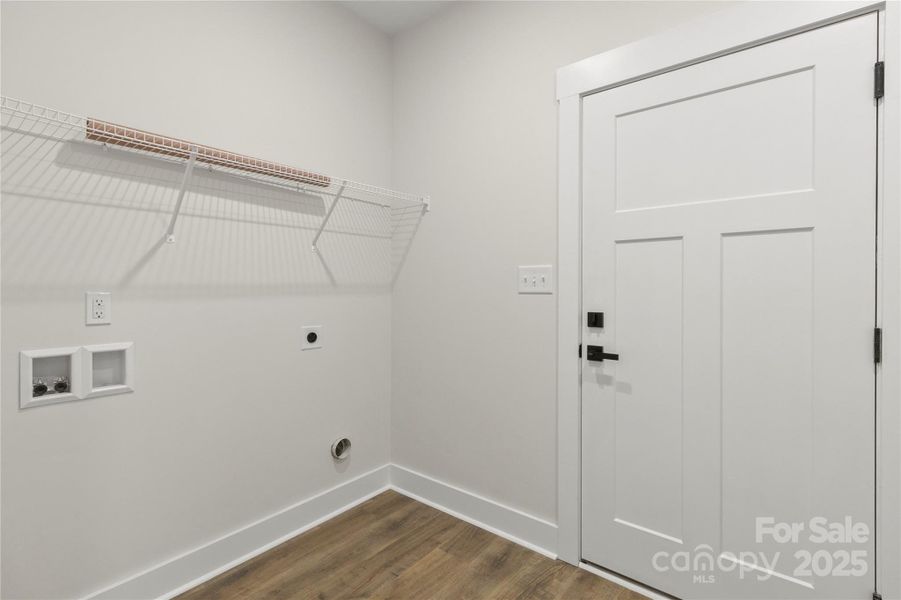Mud room with utility sink on the other side of laundry room. This is a pass through from garage