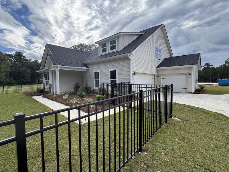 Front exterior of a new home in Central Estates, Summerville, SC, highlighting curb appeal (Image 23).