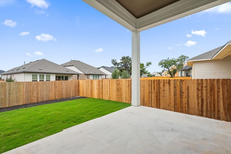 Exterior details and patio area of a home in Heritage, Dripping Springs (Image 4).