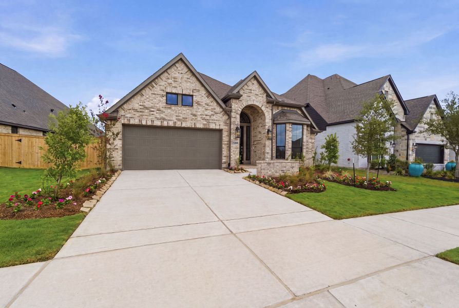 Front exterior of a new home in Bridgeland 50′, Cypress, TX, highlighting curb appeal (Image 19).