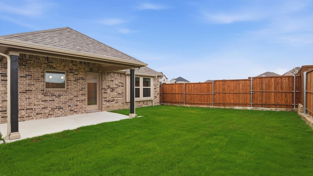 Exterior details and patio area of a home in Westridge Journey, Princeton (Image 25).