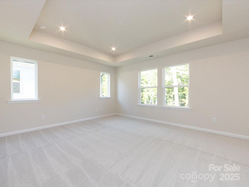 Huge primary suite filled with light!