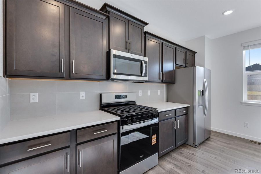 Furnished interior view inside a new home in Trails at Crowfoot, Parker (Image 11).