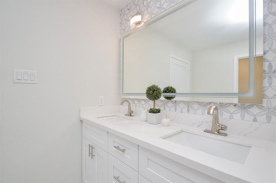 Primary bathroom:Photo is not of the actual home, but is an inspirational photo od the the builder's model and may depict options, furnishings, and/or decor features that are not included.Photos of home will be uploaded shortly.