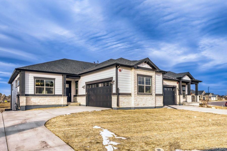 Front exterior of a new home in Knolls, Westminster, CO, highlighting curb appeal (Image 1). Front exterior of a new home in Knolls, Westminster, CO, highlighting curb appeal (Image 1).