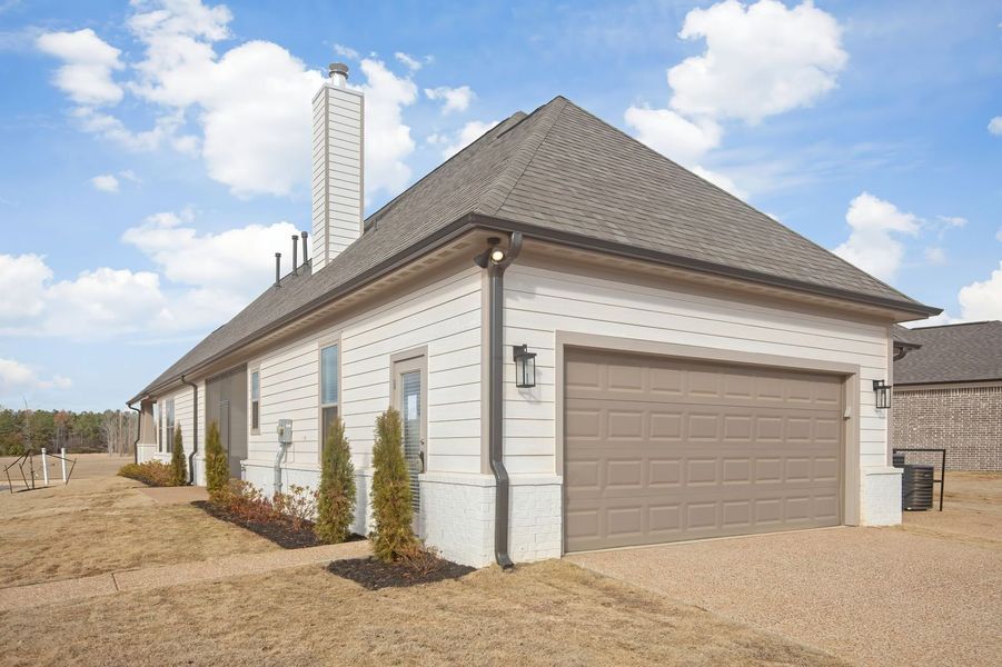 Front exterior of a new home in Twin Oaks, Oakland, TN, highlighting curb appeal (Image 27). Front exterior of a new home in Twin Oaks, Oakland, TN, highlighting curb appeal (Image 27).