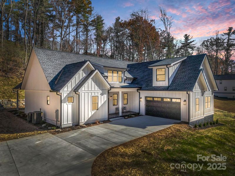 Front exterior of a new home in , Hendersonville, NC, highlighting curb appeal (Image 28).