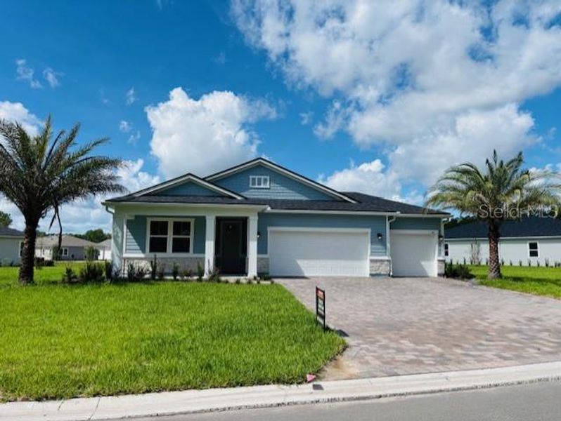 Front exterior of a new home in , Palm Coast, FL, highlighting curb appeal (Image 1).