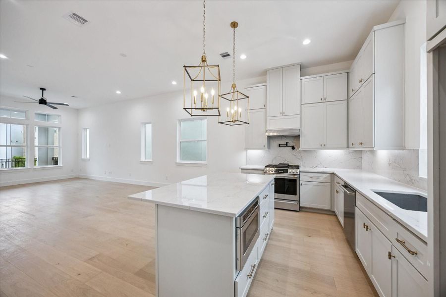 Stunning kitchen featuring modern finishes, ample counter space, and a design that’s perfect for both everyday living and entertaining.