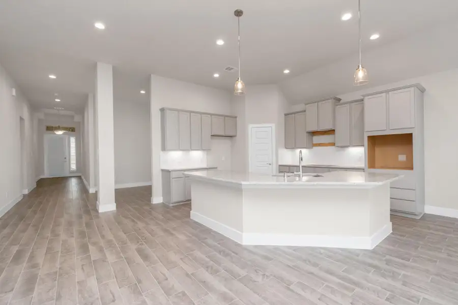 This generously spacious kitchen is a dream realized! Sample photo of completed home with similar floor plan. Actual colors and selections may vary. This generously spacious kitchen is a dream realized! Sample photo of completed home with similar floor plan. Actual colors and selections may vary.
