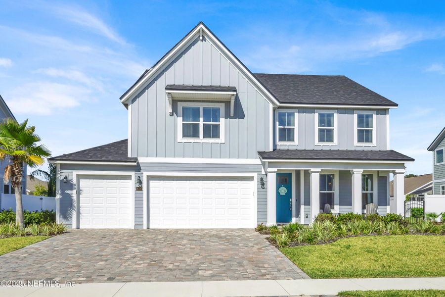 Front exterior of a new home in Seaside Vista, St. Augustine, FL, highlighting curb appeal (Image 2). Front exterior of a new home in Seaside Vista, St. Augustine, FL, highlighting curb appeal (Image 2).
