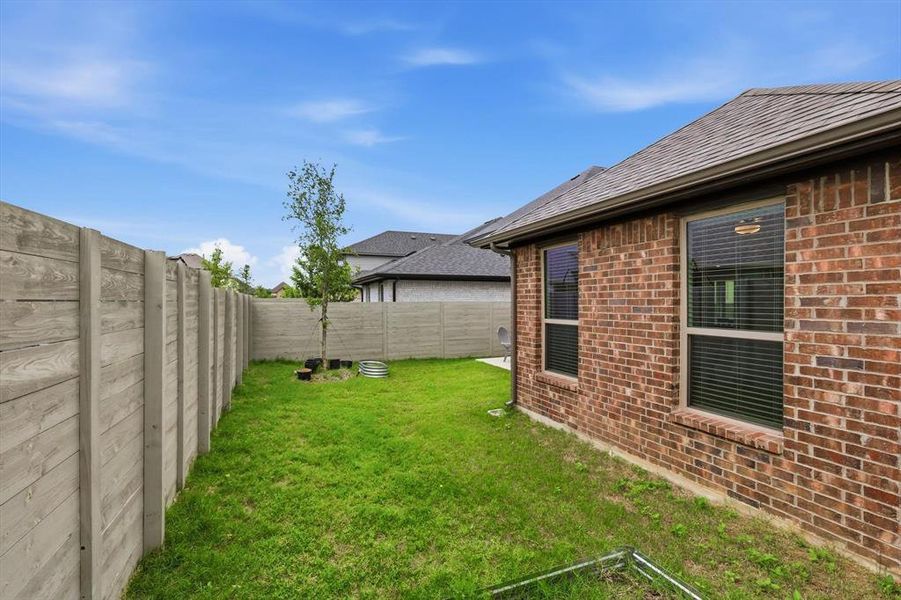 Exterior details and patio area of a home in Harvest, Argyle (Image 23).