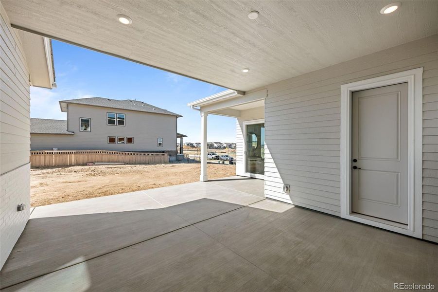 Front exterior of a new home in Painted Prairie, Aurora, CO, highlighting curb appeal (Image 25).