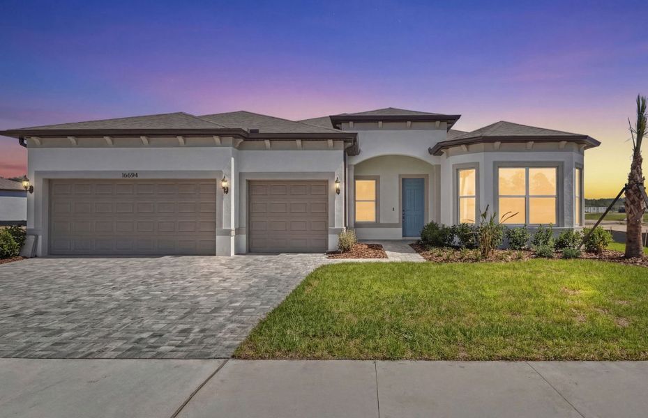 Front exterior of a new home in Del Webb River Reserve, Spring Hill, FL, highlighting curb appeal (Image 2). Front exterior of a new home in Del Webb River Reserve, Spring Hill, FL, highlighting curb appeal (Image 2).