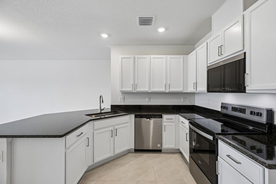 Furnished interior view inside a new home in Reserve at Forest Lake Townhomes, Lake Wales (Image 5).