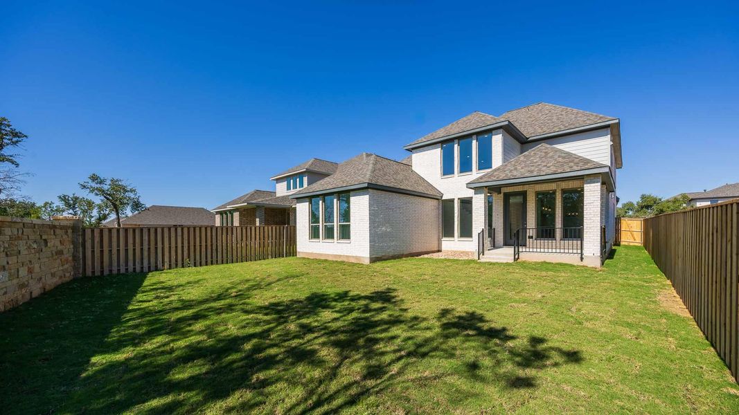 Exterior details and patio area of a home in Parmer Ranch 50', Georgetown (Image 3).