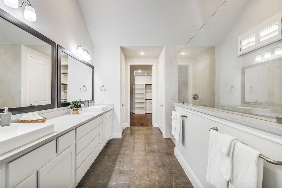 This primary bath is 13 x14, with two vanity spaces and two quartz composite sinks and soft close drawers and cabints. This primary bath is 13 x14, with two vanity spaces and two quartz composite sinks and soft close drawers and cabints.