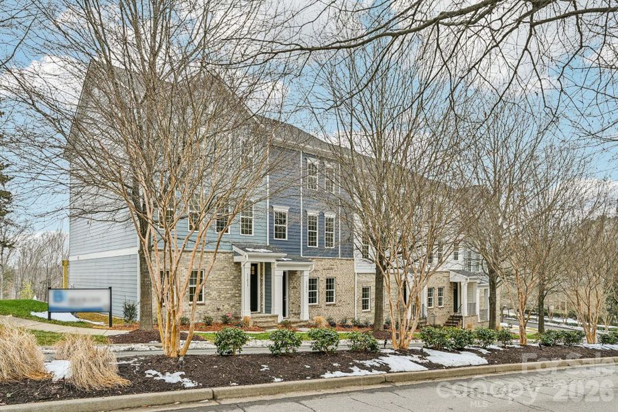 Front exterior of a new home in Vanguard at Vermillion, Huntersville, NC, highlighting curb appeal (Image 1). Front exterior of a new home in Vanguard at Vermillion, Huntersville, NC, highlighting curb appeal (Image 1).