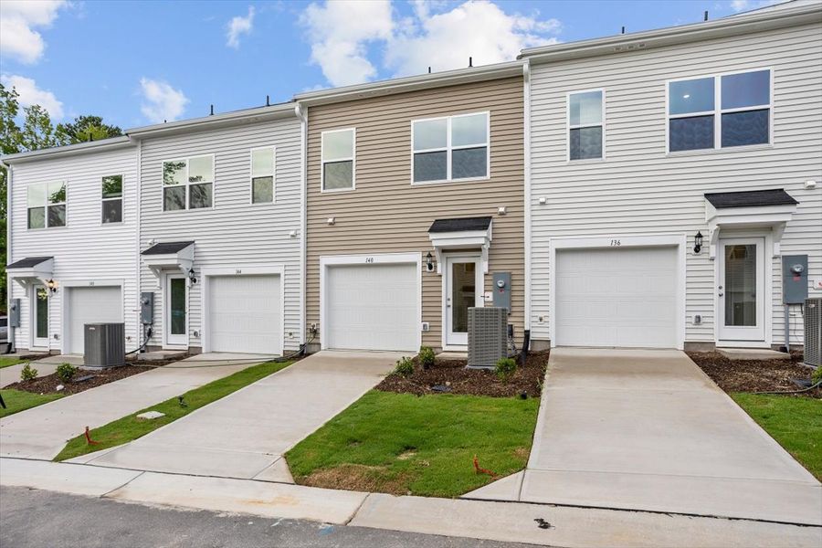 Front exterior of a new home in Renaissance at White Oak, Garner, NC, highlighting curb appeal (Image 19).