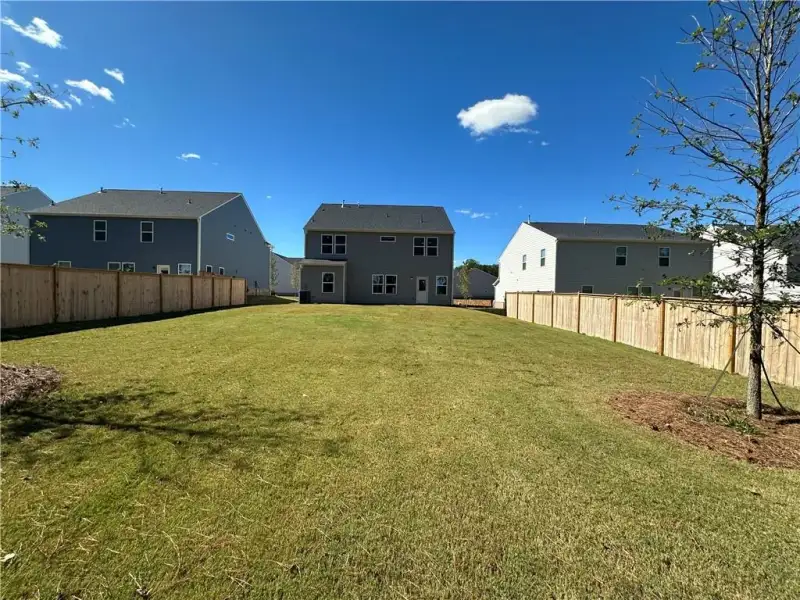 Exterior details and patio area of a home in Hawthorne Ridge, McDonough (Image 3).