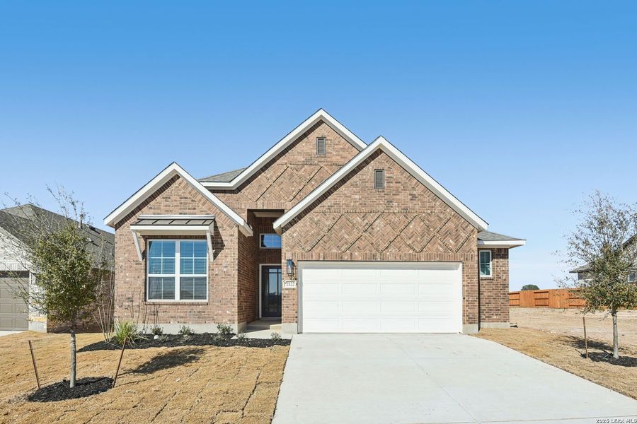 Front exterior of a new home in Stream Waters, Seguin, TX, highlighting curb appeal (Image 1). Front exterior of a new home in Stream Waters, Seguin, TX, highlighting curb appeal (Image 1).