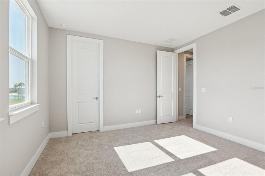 Spacious, unfurnished interior of a new home in Lagoon Residences at Epperson, Wesley Chapel (Image 31).