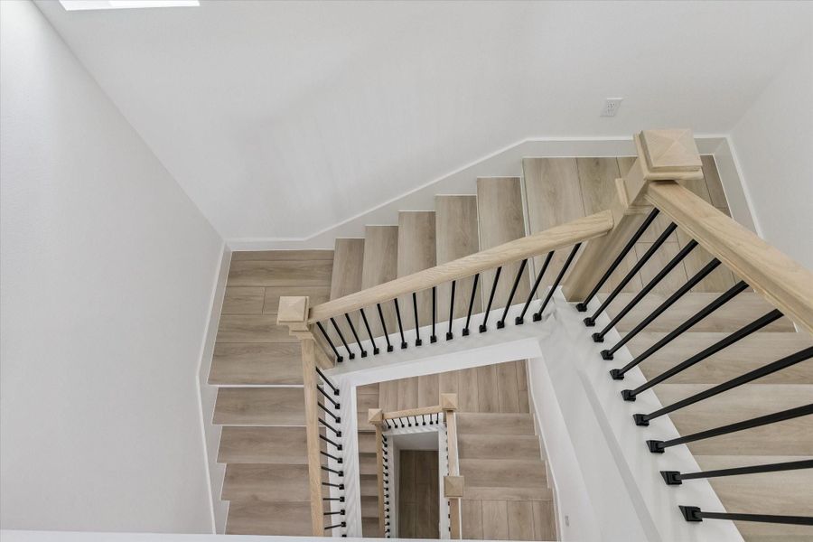 Staircase detail showcasing modern railing and multi-level design Staircase detail showcasing modern railing and multi-level design