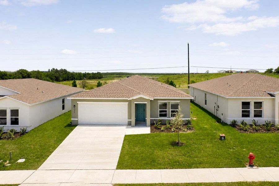 Front exterior of a new home in Scenic Terrace, Lake Hamilton, FL, highlighting curb appeal (Image 2). Front exterior of a new home in Scenic Terrace, Lake Hamilton, FL, highlighting curb appeal (Image 2).