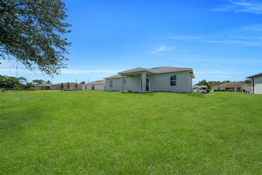 Front exterior of a new home in , Lehigh Acres, FL, highlighting curb appeal (Image 2). Front exterior of a new home in , Lehigh Acres, FL, highlighting curb appeal (Image 2).