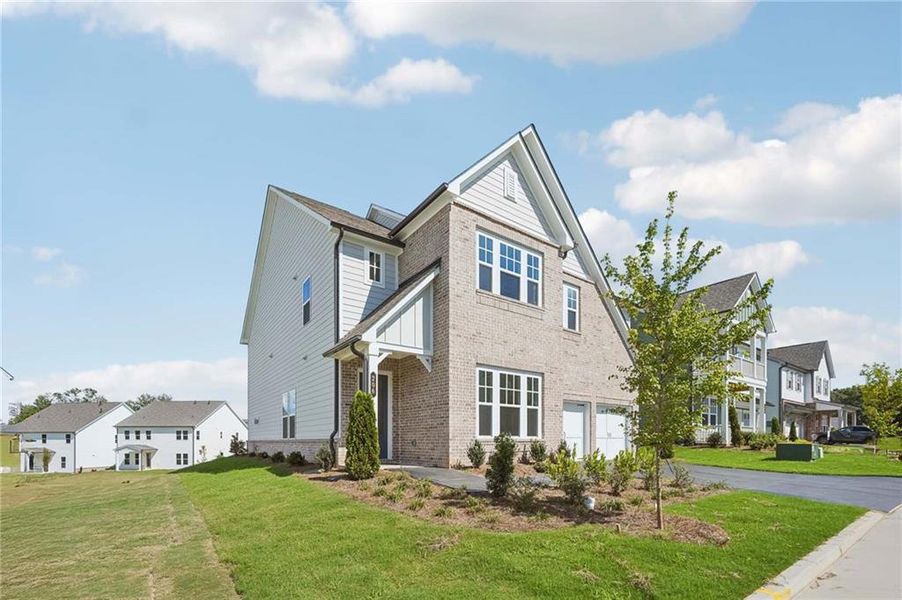 Front exterior of a new home in East Harbor II at Chestatee, Dawsonville, GA, highlighting curb appeal (Image 2).