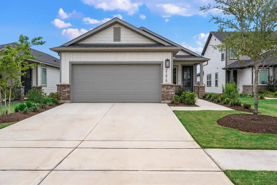 Front exterior of a new home in Mason Woods, Cypress, TX, highlighting curb appeal (Image 24).