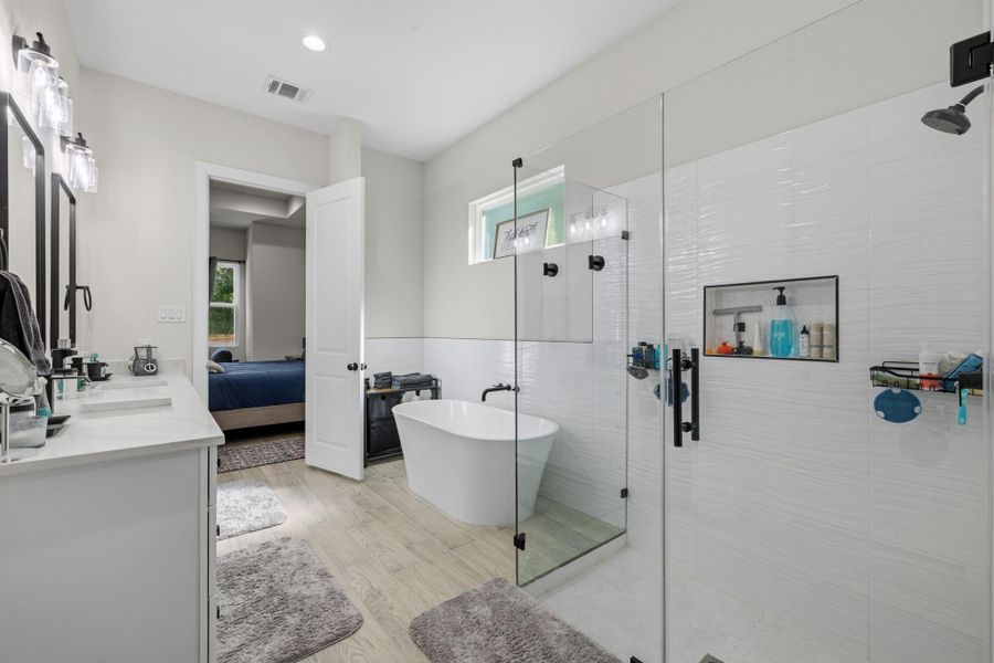 Stand up shower and freestanding tub.